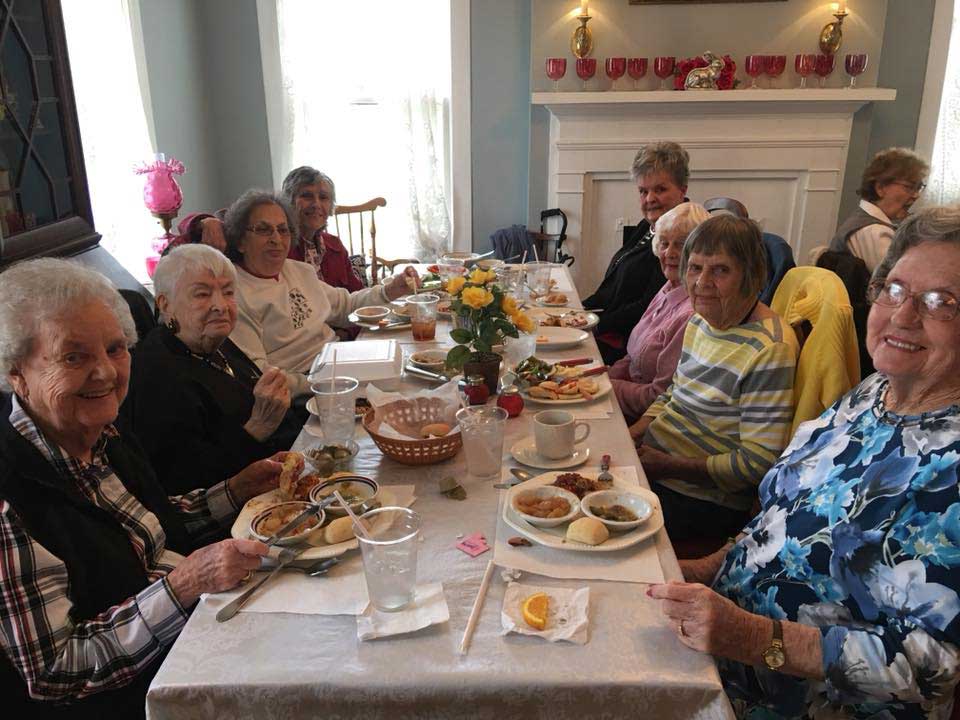group of residents enjoying dinner